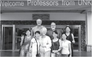 Group Under Welcome Sign