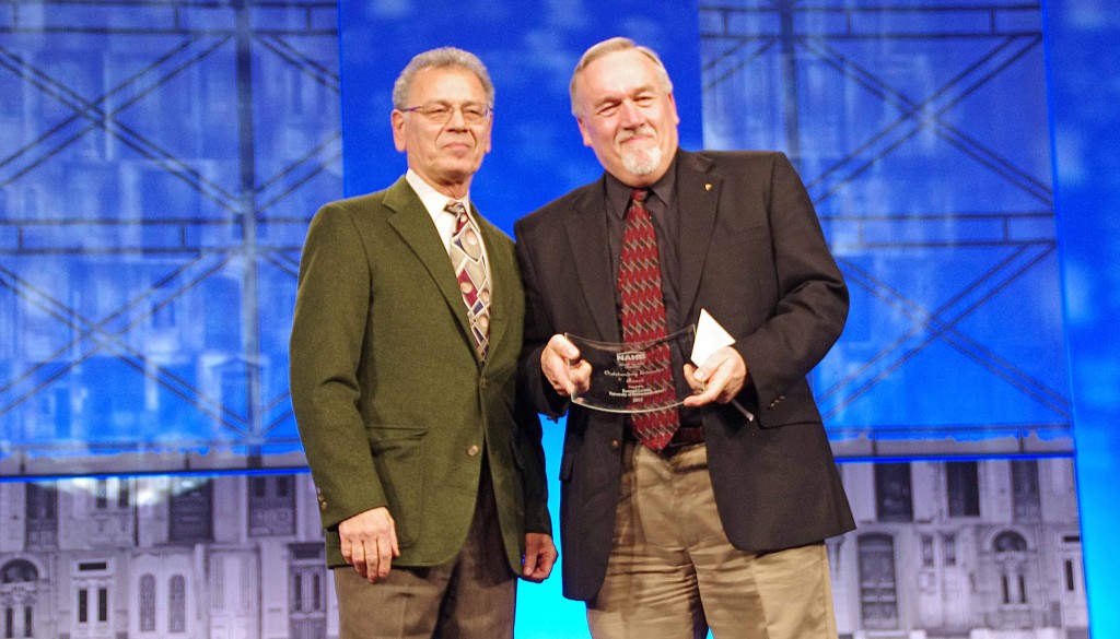 Construction management professor Ken Larson, right, is presented the Outstanding Educator Award at the 2014 National Association of Home Builders International Builders’ Show in Las Vegas.