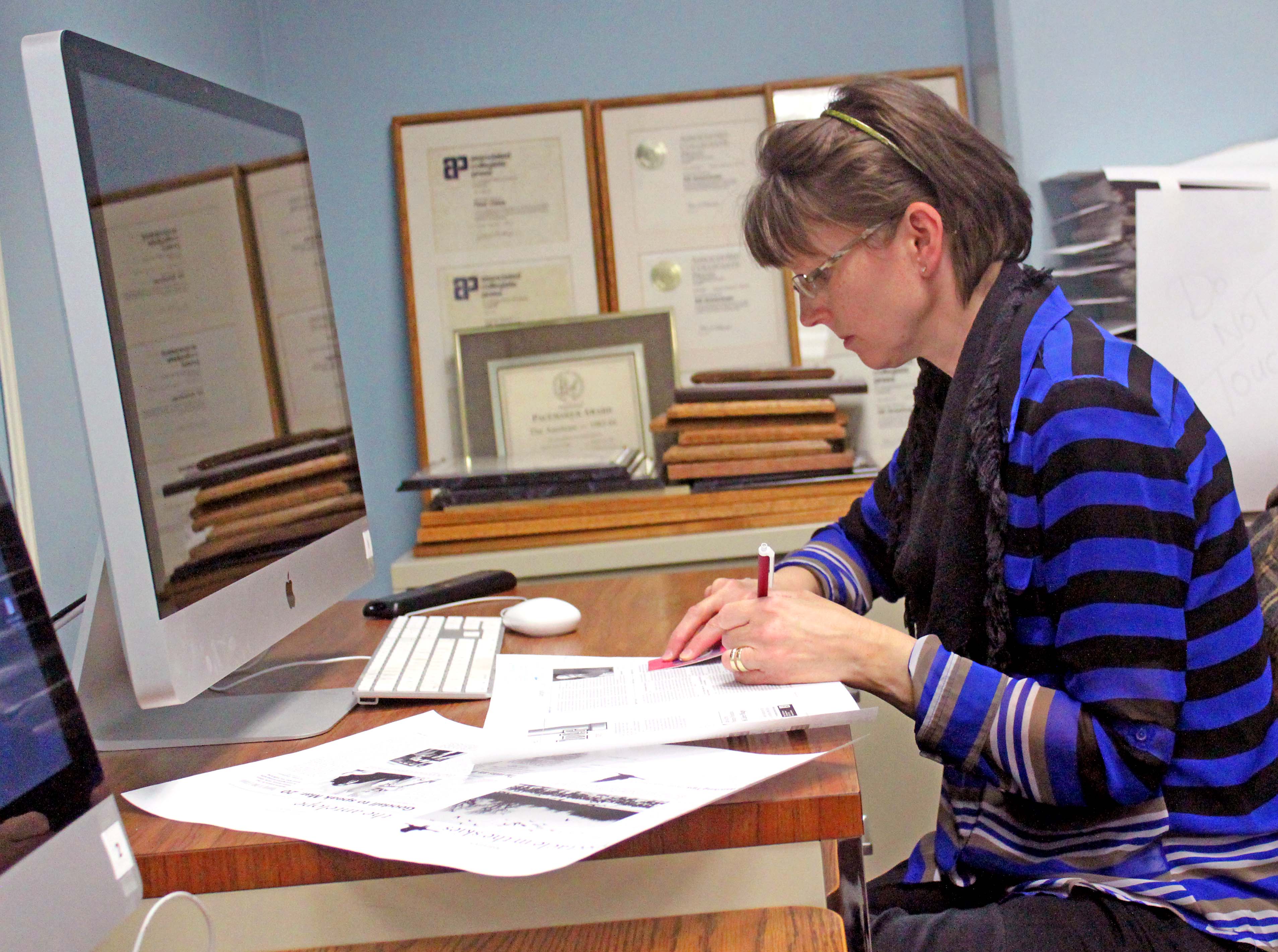 Joene Crocker edits a page for the UNK student newspaper, The Antelope, where she is a member of the staff. (Photo by Austin Koeller/UNK Communications)