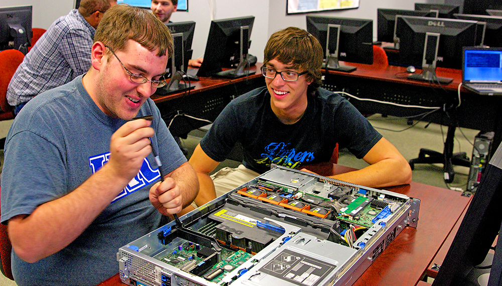 UNK Computer Science and Information Technology students Spencer Knight of North Platte, left, and Devin McIntyre of Odell work with an Intel Galileo hardware development board. UNK received 10 of the circuit boards as part of Intel’s University Donation Program. Students will use the Galileo boards in several courses, such as operating systems and computer organization. They also can be used in research projects in areas of robotics, sensor networks or embedded systems.