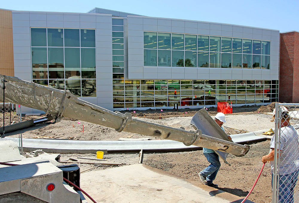 Workers continue to put the finishing touches on the UNK Wellness Center, which opens to students Aug. 1.