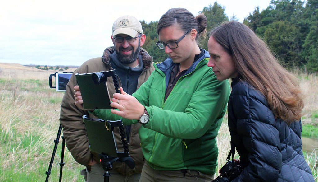 UNK faculty Keith Geluso, left, Mary Harner, right, and Emma Brinley Buckley live stream video from a ranch near Burwell to students across Nebraska. Buckley is a research technician in the UNK Department of Communication.