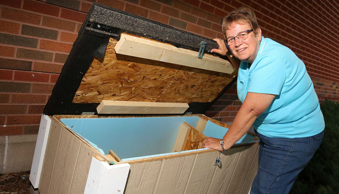 Sherry Morrow is among a group of cat lovers who has enlisted volunteers to build feeding stations and raise funds to care for cats on the UNK campus. (Photo by Corbey R. Dorsey/UNK Communications)