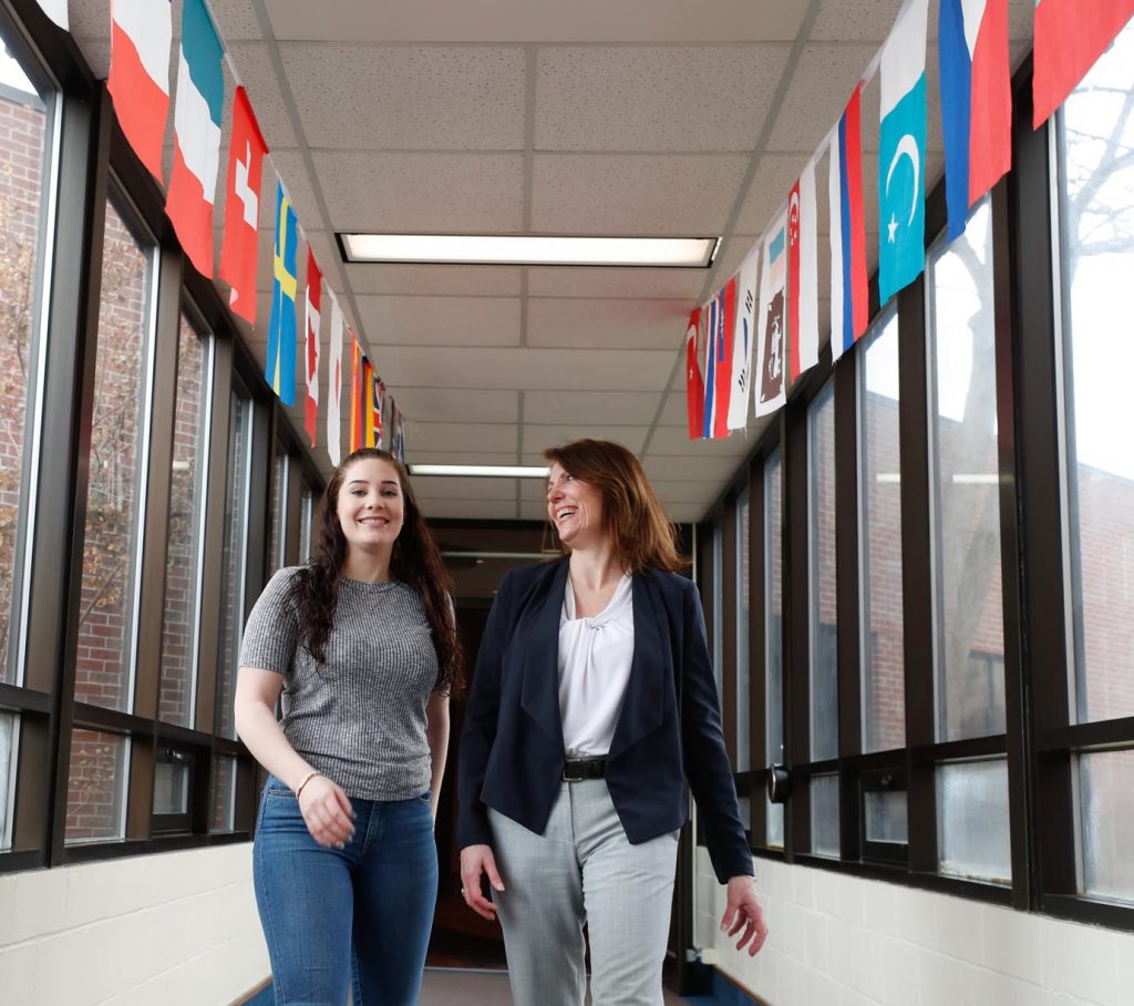 University of Nebraska at Kearney economics lecturer Theresa Yaw, right, is happy to have Lena Janssen back in Kearney. Janssen, a native of Germany, stayed with the Yaw family for a year during high school then decided to attend UNK. (Photo by Corbey R. Dorsey, UNK Communications)