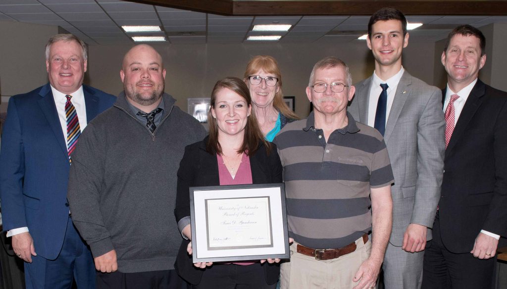 Traci was recognized and given the KUDOS award at the Board of Regents meeting, which was attended by (from left) UNK Chancellor Doug Kristensen; her husband, Lance; parents Kelly and William Schellhase; UNK student regent Austin Partridge; and NU President Hank Bounds. (Photo by Gregory Nathan, University Communication)