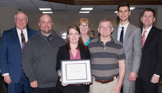 Traci was recognized and given the KUDOS award at the Board of Regents meeting, which was attended by (from left) UNK Chancellor Doug Kristensen; her husband, Lance; parents Kelly and William Schellhase; UNK student regent Austin Partridge; and NU President Hank Bounds. (Photo by Gregory Nathan, University Communication)