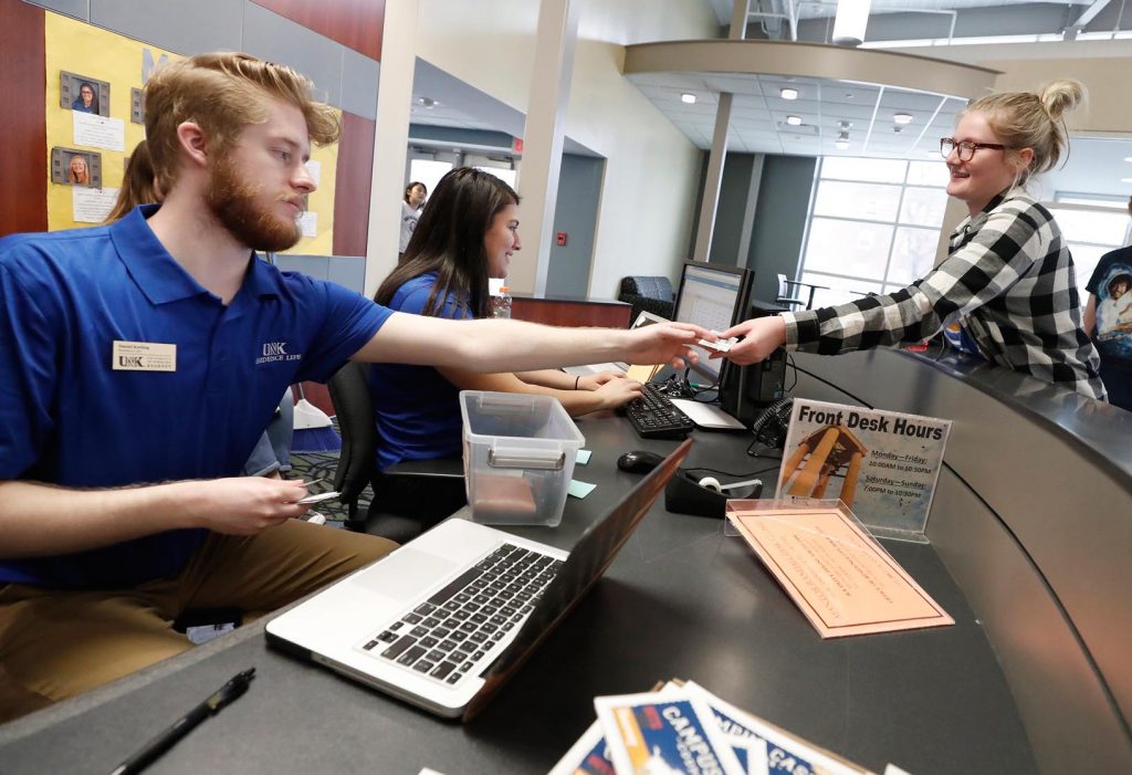 Jayde McDowell, right, a freshman from Ravenna, works with Daniel Keeling from UNK Residence Life on Wednesday as she completes her checkout from Randall Hall. McDowell called her time in the residence hall a positive experience, “because that’s where I met all of my friends.” (Photo by Corbey R. Dorsey, UNK Communications)
