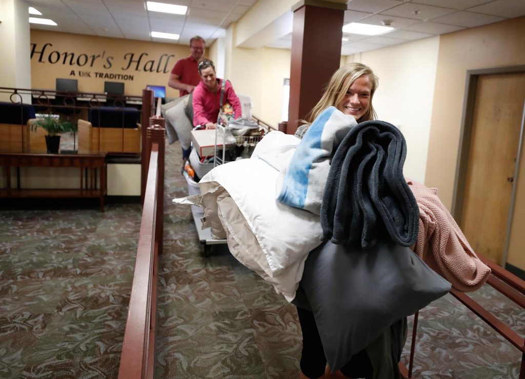 UNK student Samantha Schindler of Fremont gets some assistance from her parents Kristi and Don on Wednesday while moving out of Randall Hall. About 1,500 students live in the nine residence halls on the UNK campus. (Photo by Corbey R. Dorsey, UNK Communications)