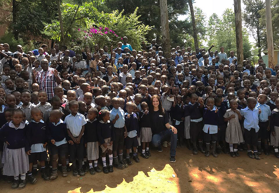 UNK senior Keegan Francl, front middle, gathers with children from the Overcoming Faith school and orphanage in Kenya. Francl, a Grand Island native and president of the Rotaract group at UNK, plans to organize a fundraiser during the upcoming school year to help pay for Kenyan students’ education. (Courtesy photo)