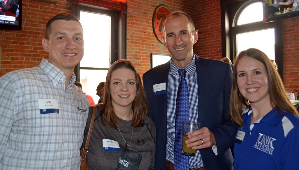 Vice President of Alumni Relations Lucas Dart, third from left, meets with UNK alumni, from left to right, Joey Coachran, Amber Cochran and Angela Davidson at a Kearney Quarterly event at Cunningham’s Journal.