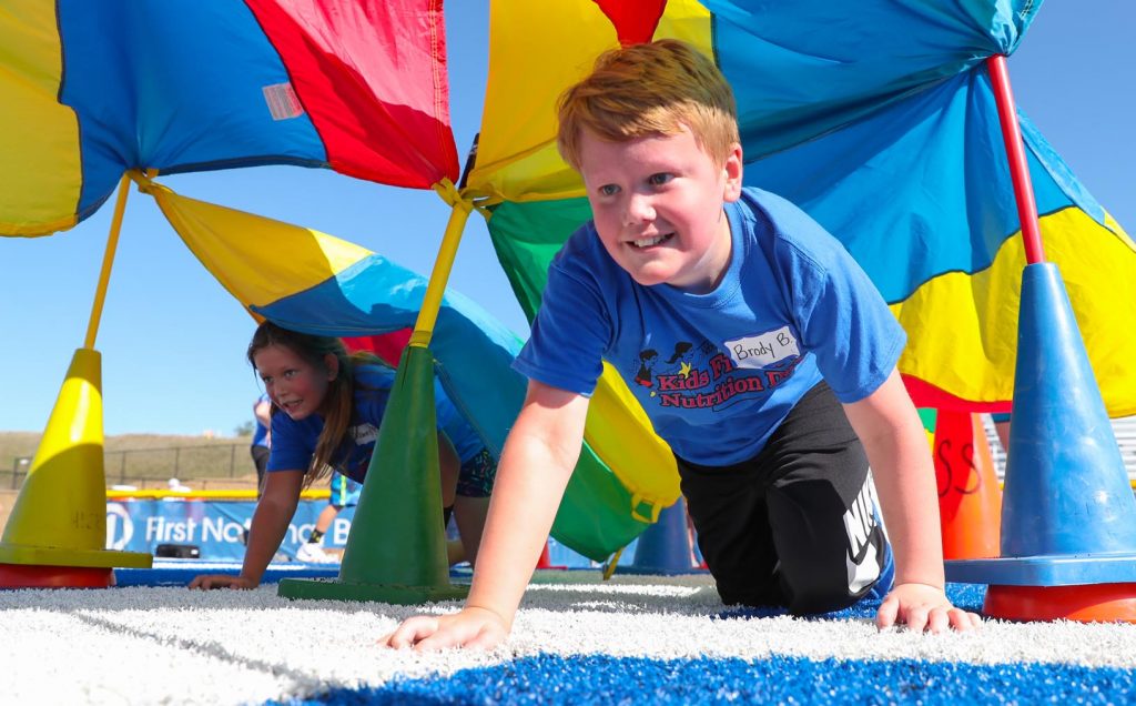 Brody Barker of Meadowlark Elementary in Kearney participates in a game at Nebraska Kids Fitness and Nutrition Day. More than 800 fourth-grade students from central Nebraska attended Friday’s event, learning about fitness and healthy eating. (Photo by Corbey R. Dorsey, UNK Communications)