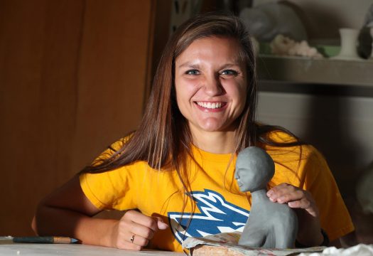 UNK senior Ciera Clark says she’s “two completely different people” on the soccer field and in the ceramics studio. The studio art major with a ceramics emphasis creates pieces that address body image issues. (Photo by Corbey R. Dorsey, UNK Communications)