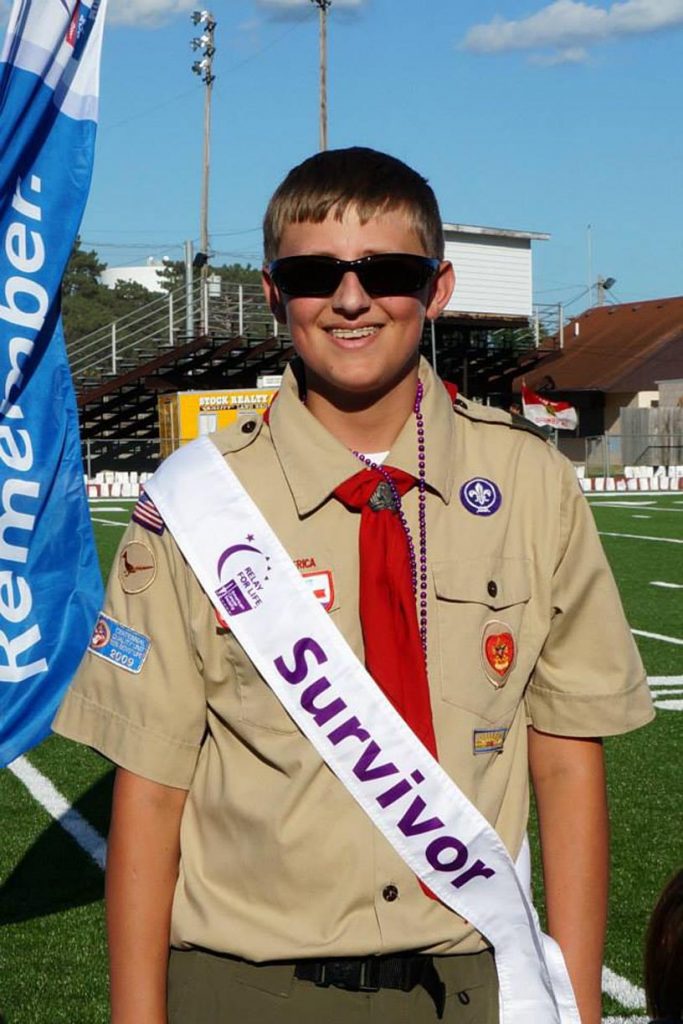 Kyle Anderson poses for a photo during a Relay for Life event in his hometown of Columbus. The UNK sophomore battled osteosarcoma for six years. (Courtesy photo)