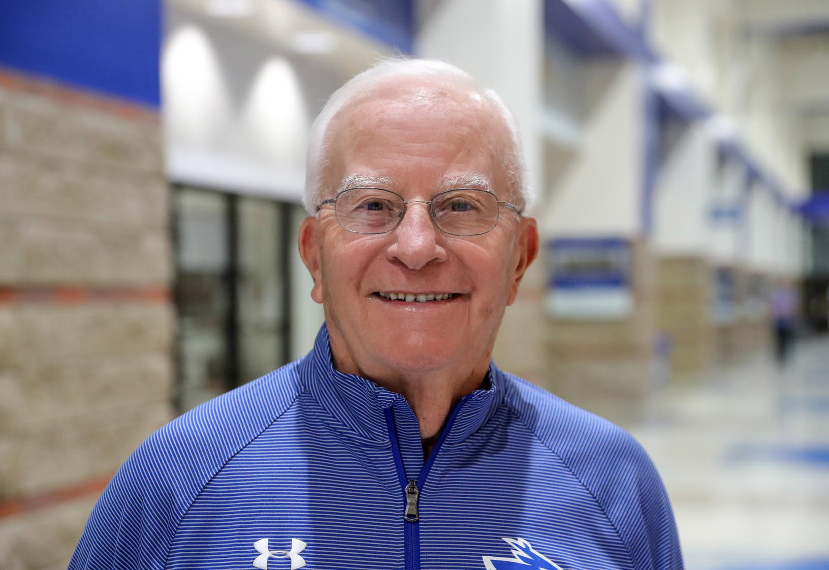 Earl Rademacher, 85, and his wife JoAnn are regulars at UNK sporting events. He played tennis for the school in the early 1950s. (Photo by Corbey R. Dorsey, UNK Communications)