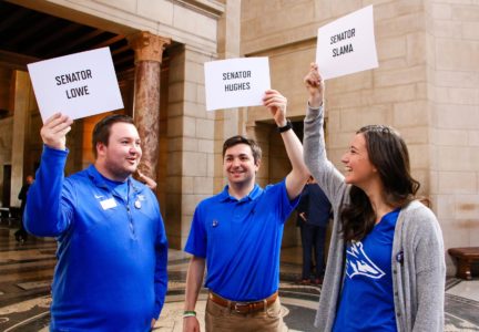 From left, UNK students Taylor and Trey Janicek of Bridgeport and Nicole Kent of Benkelman wait for state senators to enter the Capitol Rotunda during “I Love NU Advocacy Day” in Lincoln. Wednesday’s event gave University of Nebraska supporters an opportunity to meet with lawmakers, share their stories and discuss the university system’s impact on the state. (Photo by Amanda Andresen, UNK Communications)