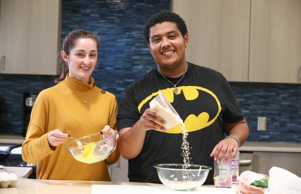 UNK students Blanca Gil of Spain, left, and Jahad Al Bulushi of Oman are preparing popular dishes from their home countries to serve at the Scott D. Morris International Food and Cultural Festival. The event, scheduled for Sunday (March 10) at UNK’s Health and Sports Center, will feature cuisine from nine different countries. (Photo by Corbey R. Dorsey, UNK Communications)