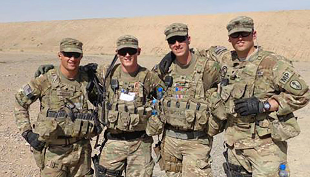 UNK student Jerromy Cissell, second from left, is pictured with his military police team during a deployment to southern Afghanistan. Cissell, who graduates from UNK next week, put his education on hold twice for yearlong deployments as a U.S. Army Reserve member. (Courtesy photo)