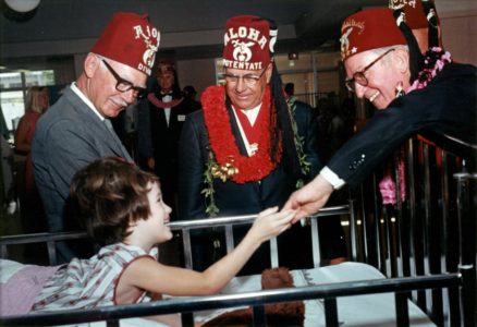 Jan Moore meets silent film star Harold Lloyd, right, at the Shriners Hospitals for Children in Honolulu in January 1967. (Courtesy photo)