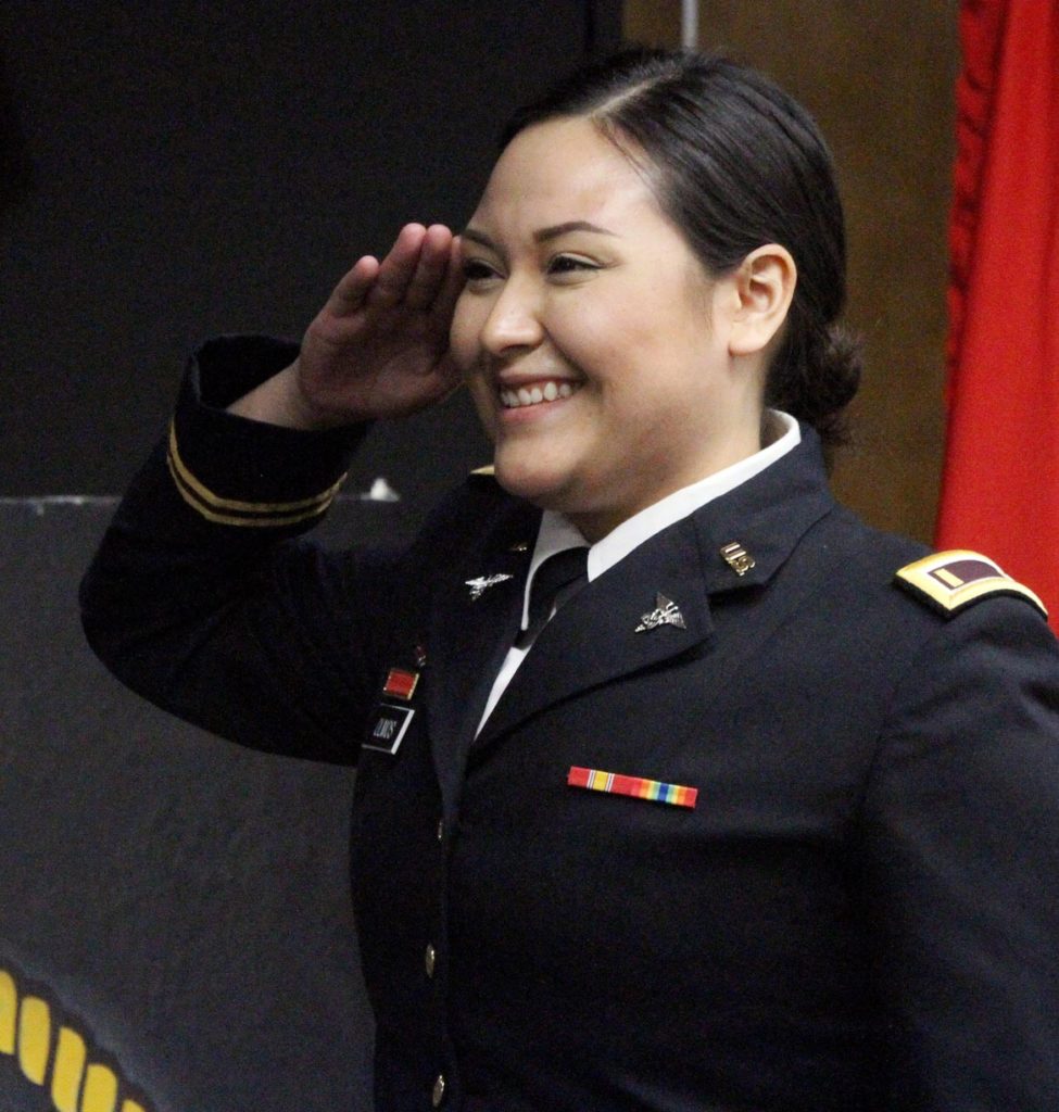 Jeysel Olmos gives her first salute as a second lieutenant in the Nebraska Army National Guard during an ROTC commissioning ceremony Friday at UNK. (Photo by Tyler Ellyson, UNK Communications)