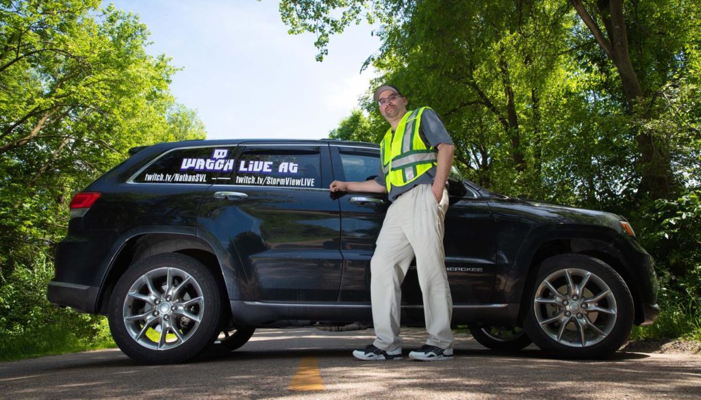 UNK employee Nathan Moore has been chasing thunderstorms and other severe weather for nearly three decades. He’s the founder and part-owner of StormViewLIVE, a network of about 140 chasers across the country who livestream video and sell content to media networks. (Photo by Corbey R. Dorsey, UNK Communicatio