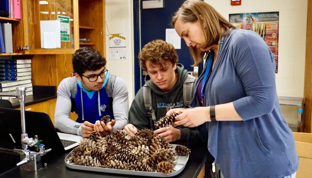 Science teacher Nicole Miller works with students in her classroom at Lakeview High School near Columbus. Miller is one of the nearly 4,400 PK-12 teachers in Nebraska who graduated from UNK. (Photo courtesy of Abbie Tessendorf)