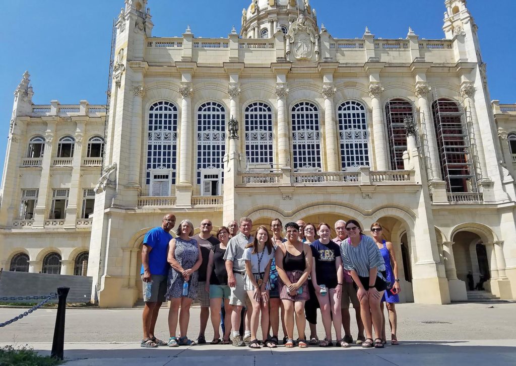 A group of 16 UNK students, faculty and community members traveled to Cuba last month for a weeklong stay. They’re pictured at the Museum of the Revolution in Havana. (Courtesy photo)