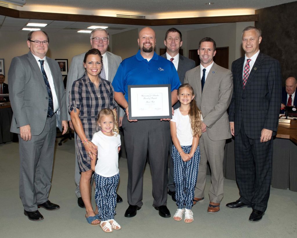 Ricci Fast was recognized at the Board of Regents meeting by UNK Chancellor Doug Kristensen, NU President Hank Bounds, UNK Police Chief Jim Davis and others. He was accompanied by his wife, Rachel, and their daughters Broxlynn and Beckitt.