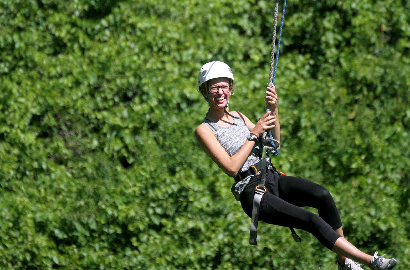 Macy Brown of Aurora soars through the Nebraska National Forest near Halsey on a zip line during UNK’s First Adventure summer camp. The program gives incoming UNK freshmen a chance to learn more about campus and each other before classes begin. (Photo by Tyler Ellyson, UNK Communications)