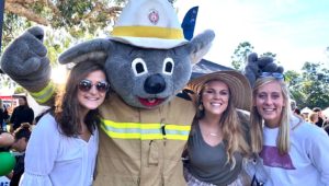 From left, UNK students Marlana Kent, Marissa Asche and Leslie Braun are pictured with a koala mascot during a NAIDOC Week event in Australia, where they spent three weeks studying abroad. NAIDOC Week celebrates the history, culture and achievements of Australia’s indigenous people. (Courtesy photo)