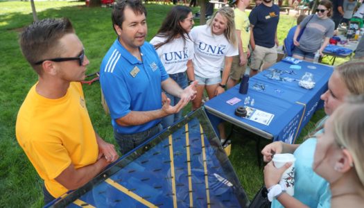 Alejandro Cahis, an industrial distribution lecturer at UNK, shares information about the program with attendees of Friday’s Blue Gold Community Showcase on the UNK campus. (Photo by Corbey R. Dorsey, UNK Communications)