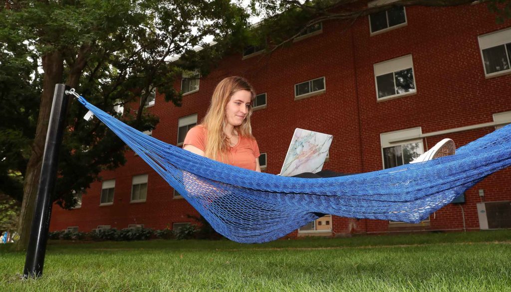 UNK student Megan Bahns of Leigh relaxes in one of 10 hammocks being installed on the UNK campus. The hammocks will be located near Centennial Towers East/Centennial Towers West, Randall Hall/Mantor Hall and the Nebraskan Student Union. (Photo by Corbey R. Dorsey, UNK Communications)