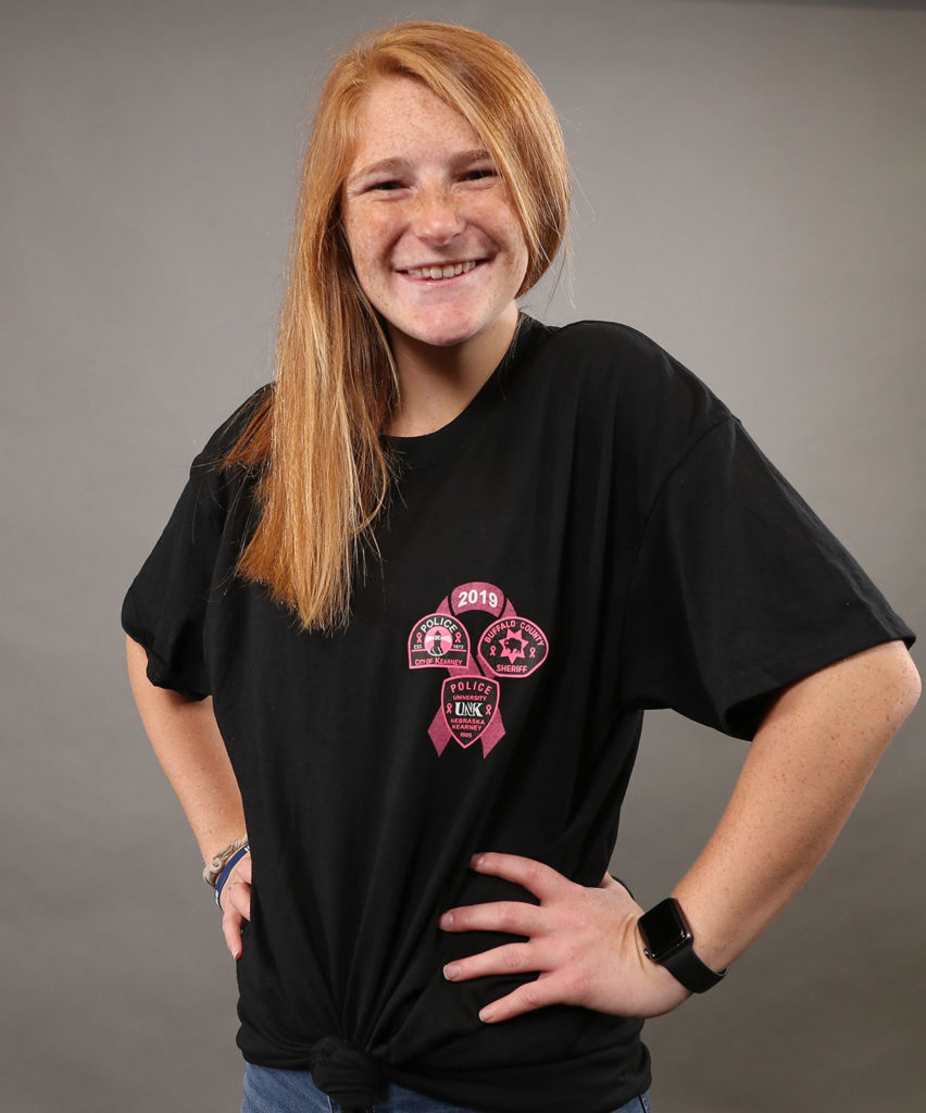 UNK sophomore Taylor Mullen-Beck models the Pink Patch Project T-shirt that can be purchased at Hy-Vee, 5212 Third Ave., or online at <a href="http://kpdpinkpatchproject.itemorder.com">kpdpinkpatchproject.itemorder.com</a>.