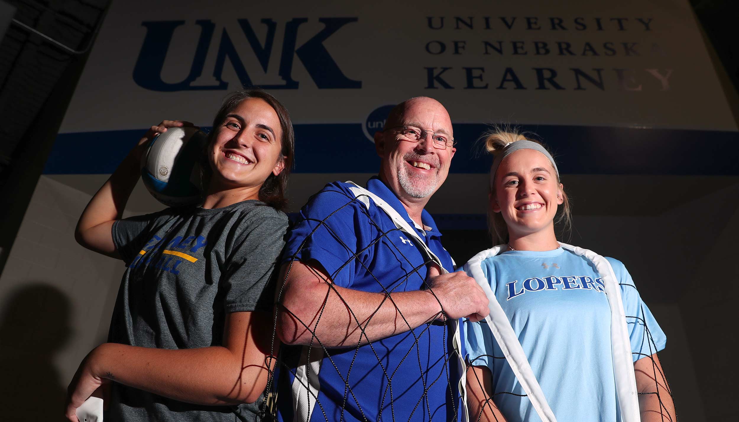 UNK head volleyball coach Rick Squiers will have daughters Anna, left, and Maddie in the starting lineup when the 11th-ranked Lopers begin the 2019 season by hosting a five-team tournament today and Saturday in the Health and Sports Center. (Photo by Corbey R. Dorsey, UNK Communications)