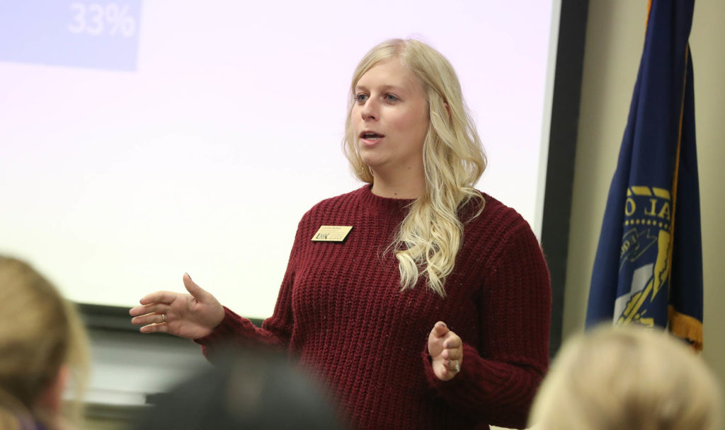 Courtney Burbach, an admissions counselor at UNK, speaks to Grand Island Senior High School students Wednesday during an event hosted by UNK’s College of Business and Technology. UNK students, staff and faculty shared information about academic programs, scholarships and financial aid, internships and campus life, and Grand Island business representatives talked about career opportunities.