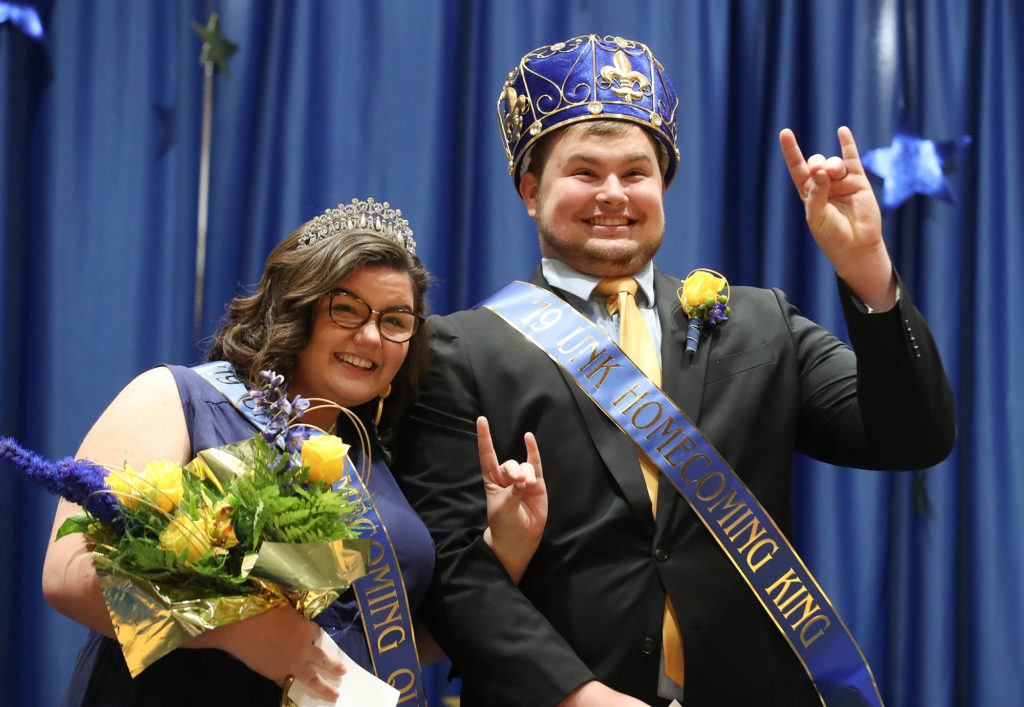 Makenzie Petersen of O’Neill and Jacob Roth of Milford “throw the Lopes” after they were crowned UNK homecoming queen and king earlier this month. (Photo by Corbey R. Dorsey, UNK Communications)