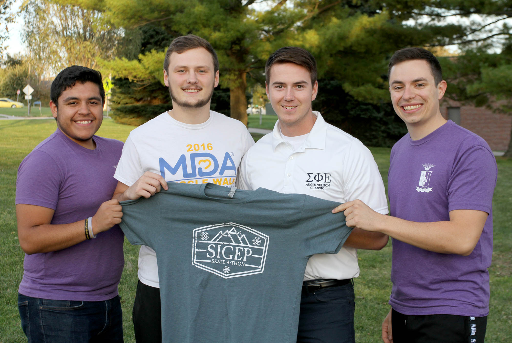 UNK’s Sigma Phi Epsilon fraternity is hosting an MDA Skate and Walk event Sunday at the Viaero Center to raise money for the Muscular Dystrophy Association and its Nebraska summer camp. Pictured, from left, are fraternity members Agustin Ruvalcaba, Jared Hunke, Corey Johnson and Austin Jacobsen. (Photo by Tyler Ellyson, UNK Communications)