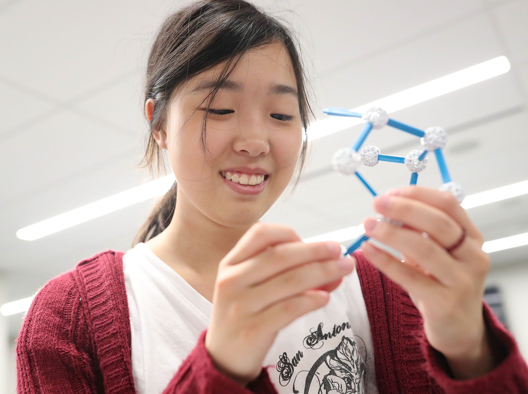 Kearney High School student Isabella Cao works on an activity Friday during an event hosted by UNK’s Department of Mathematics and Statistics. Students from Kearney and Scottsbluff also participated in a math-themed scavenger hunt on campus.