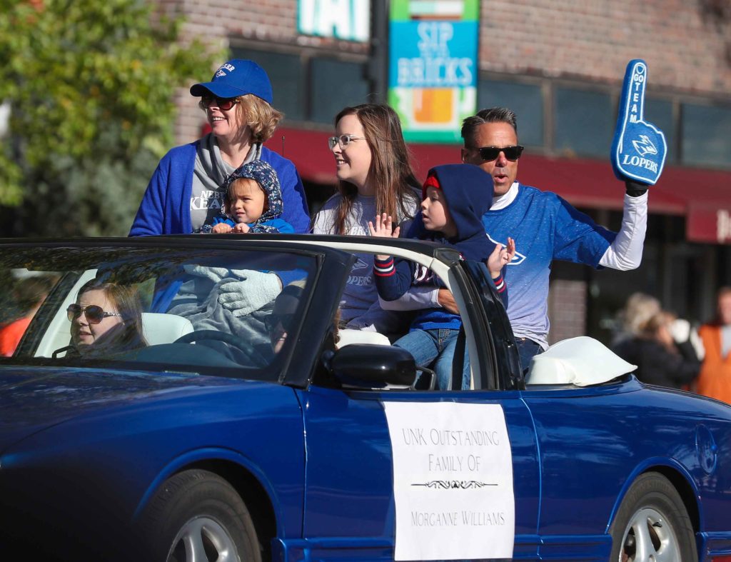 UNK’s Outstanding Family Award winners Bill and Becky Williams of Kearney ride in Saturday’s homecoming parade with daughter Morganne, a current student at UNK, and their grandchildren. Four of the five Williams children have either graduated from, attended or currently attend UNK. (Photo by Corbey R. Dorsey, UNK Communications)