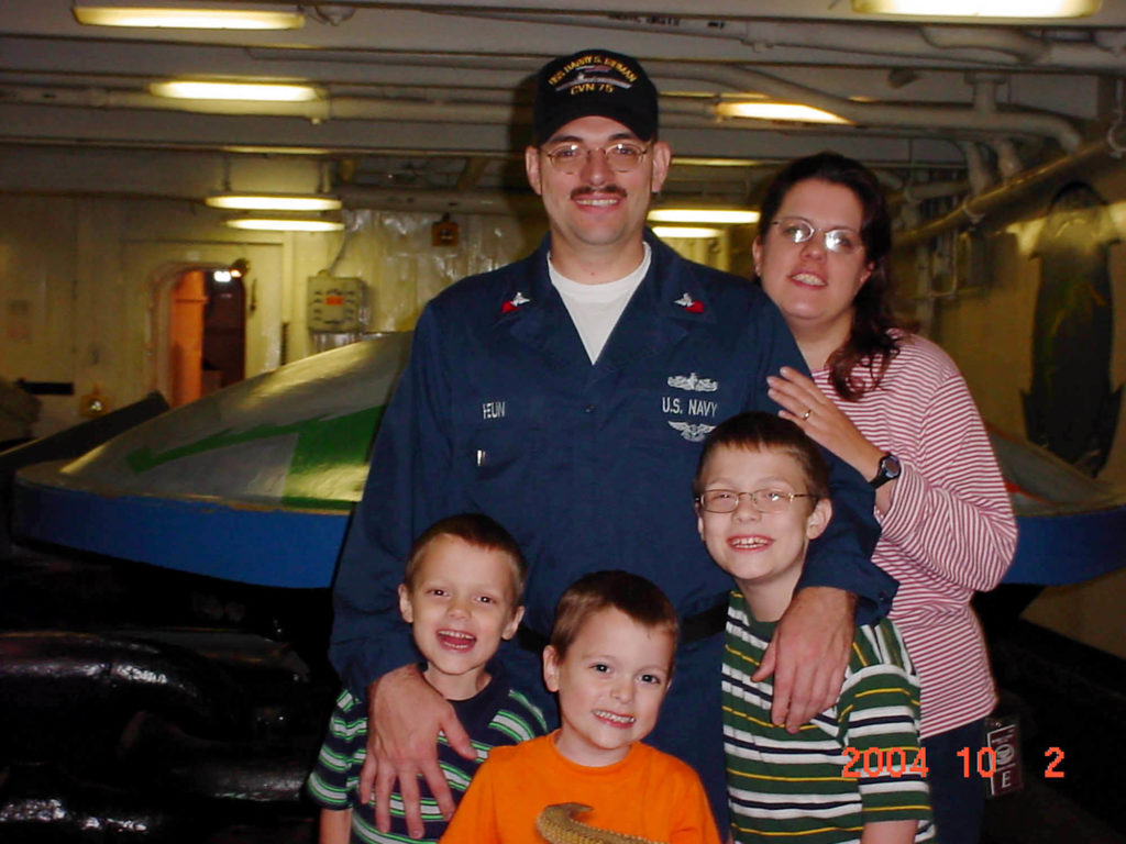 Phil Heun is pictured in October 2004 with his wife Ericka and sons, from left, Joe, Gabe and Hayden on board the USS Harry S. Truman in Norfolk, Virginia. (Courtesy photo)