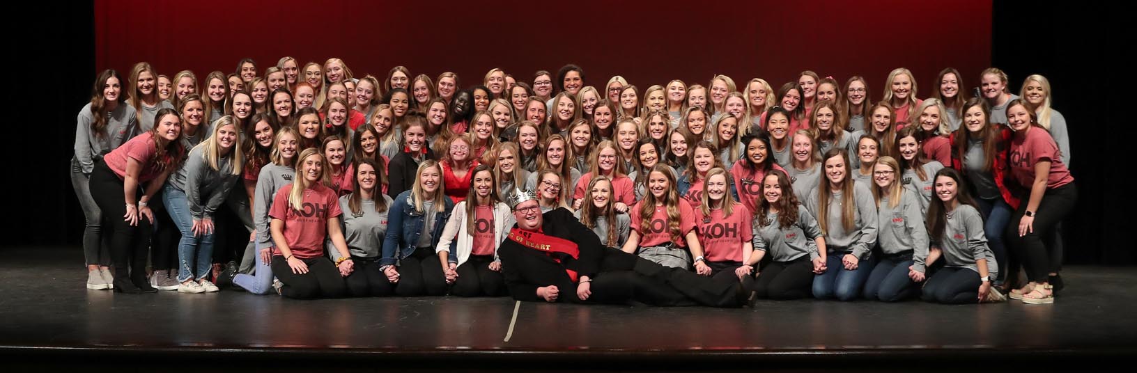 Adam Schultis poses with members of the Alpha Phi sorority after he was named Mr. King of Hearts during Thursday evening's fundraiser at Kearney High School. (Photos by Corbey R. Dorsey, UNK Communications)