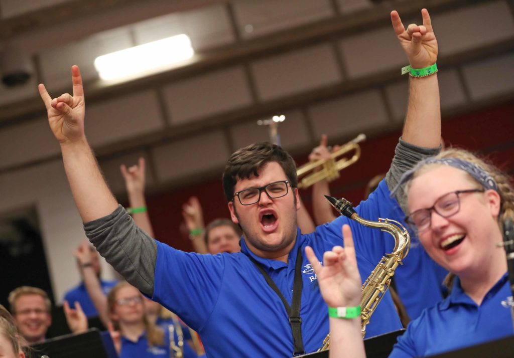 UNK pep band members Zac Dibbern of Brighton, Colorado, and Anna Overbeck of Omaha get fired up before Saturday’s NCAA Division II women’s volleyball championship at the Auraria Event Center in Denver. Twenty-four members of the UNK pep band made the 11-hour roundtrip to support the Lopers. (Photo by Corbey R. Dorsey, UNK Communications)