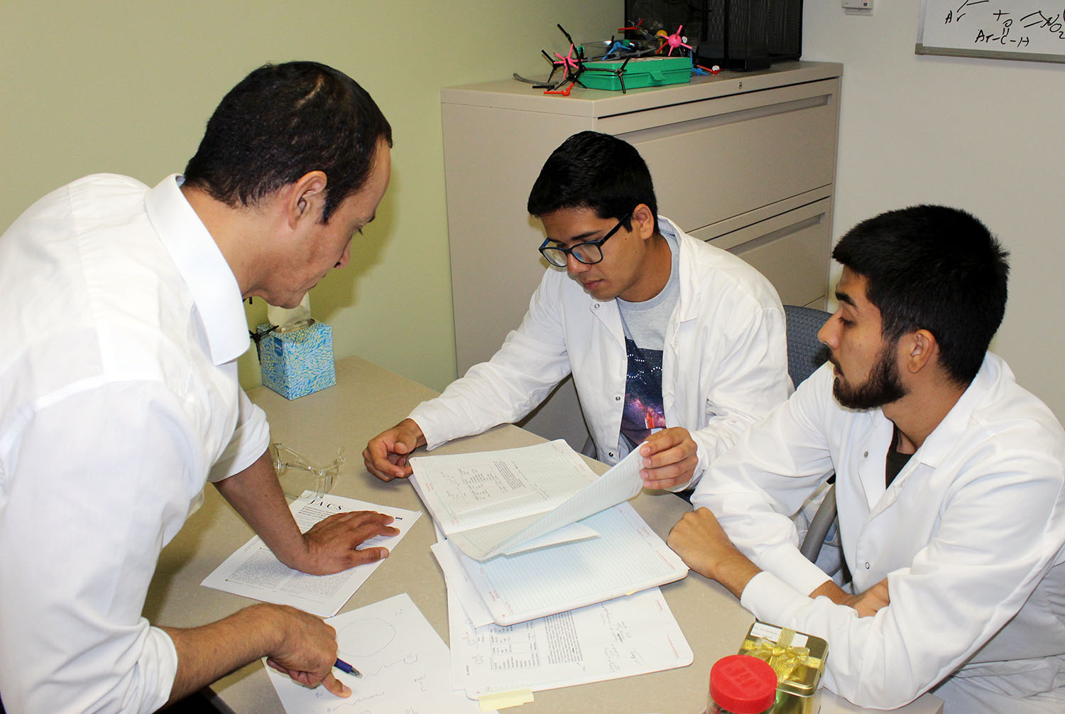 UNK chemistry professor Hector Palencia, left, hosted two students from Mexico in summer 2019 through the DELFIN research program. Emerson Francisco Arias from the Autonomous University of Nayarit, right, and Omar Lozano Ramos from the University of Colima spent seven weeks at UNK while assisting Palencia with his research.