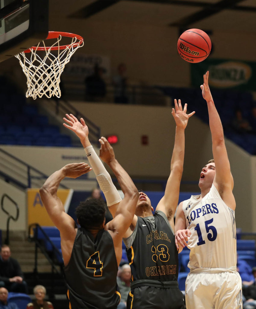 UNK forward Morgan Soucie (15) shoots over a pair of Central Oklahoma defenders during a Feb. 6 game at the Health and Sports Center. Soucie ranks sixth in the Mid-America Intercollegiate Athletics Association in field goal percentage (53.7%) and seventh in points per game (16.5).
