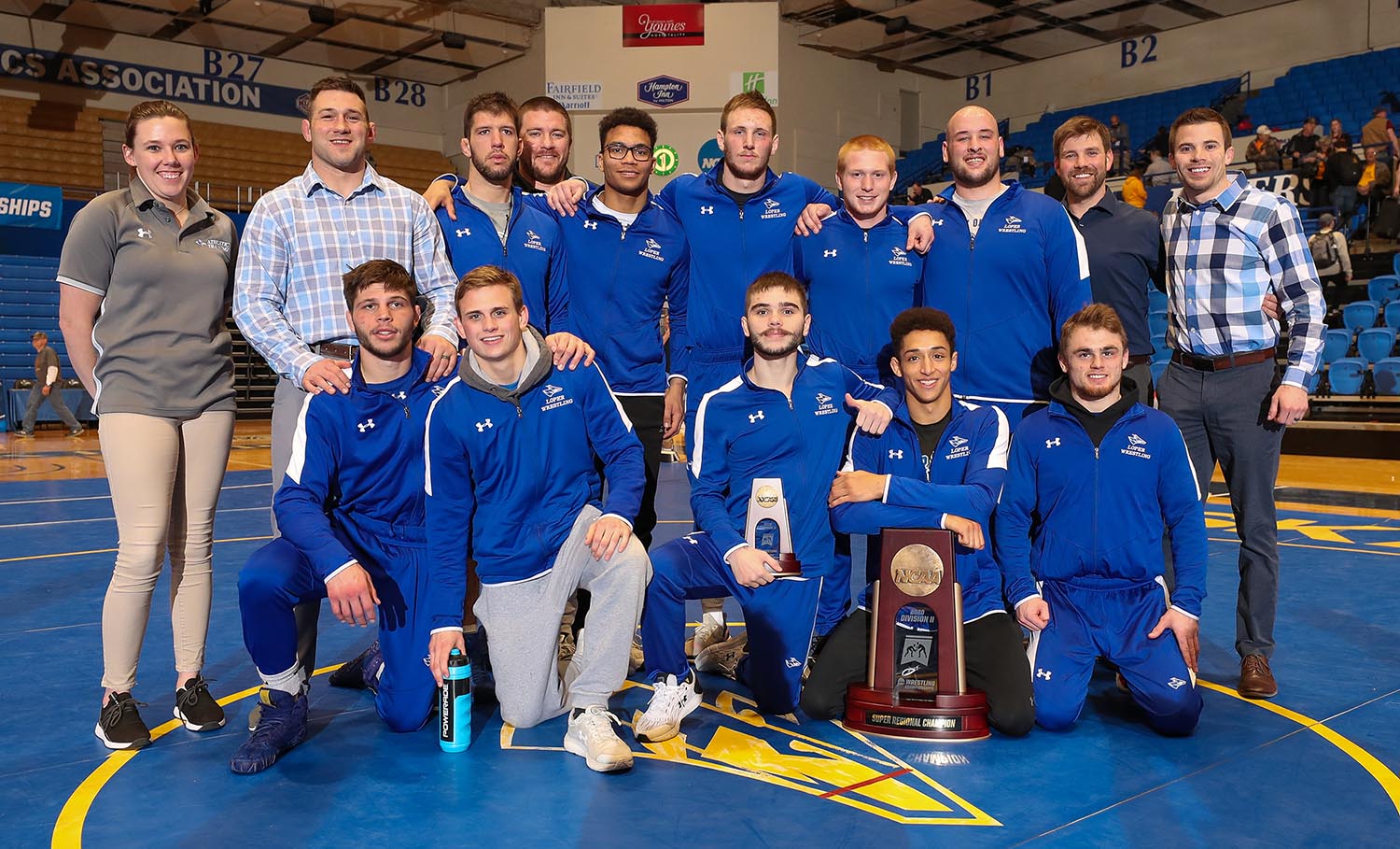 The UNK wrestling team poses for a photo Feb. 29 after winning the NCAA Super Regional VI Championships at UNK’s Health and Sports Center. Redshirt senior Jarrod Hinrichs, back row, third from right, said his coaches and teammates have been his second family over the past five years.