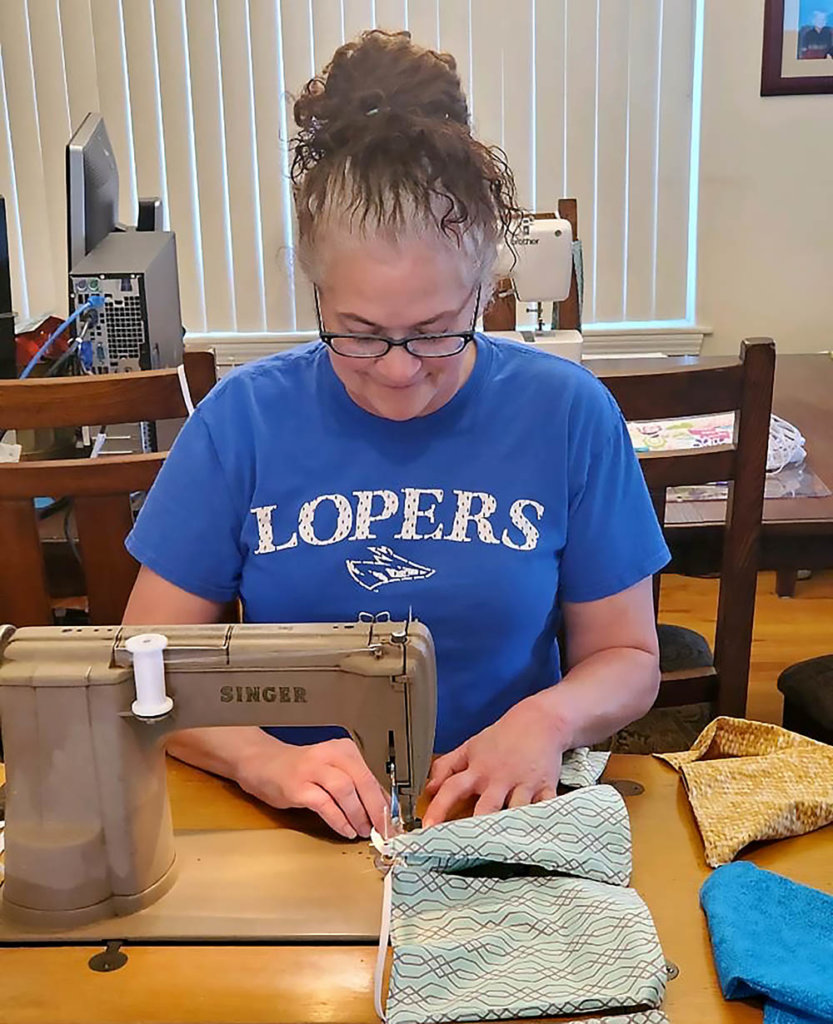 Carla Kegley-Owen, a senior lecturer in UNK’s Department of Chemistry, sews a cloth face mask at her rural Kearney home. Kegley-Owen has made more than 220 face masks for health care facilities.