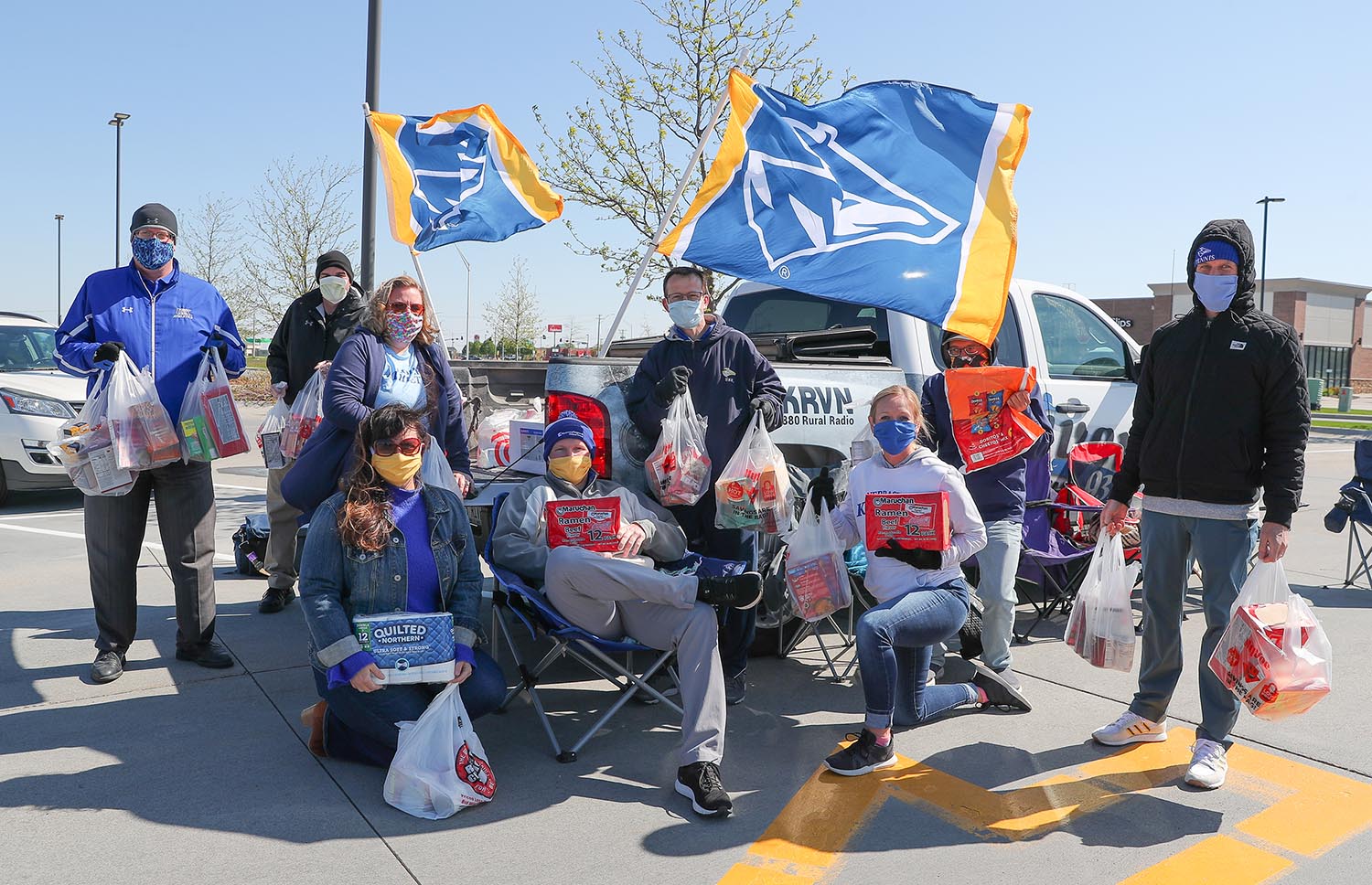Staff from UNK Athletics and KRVN Radio collected items for Big Blue Cupboard on Friday during the “Lopers Love to Help” food drive. Community members donated enough items to fill three pickup truck beds. (Photos by Corbey R. Dorsey, UNK Communications)