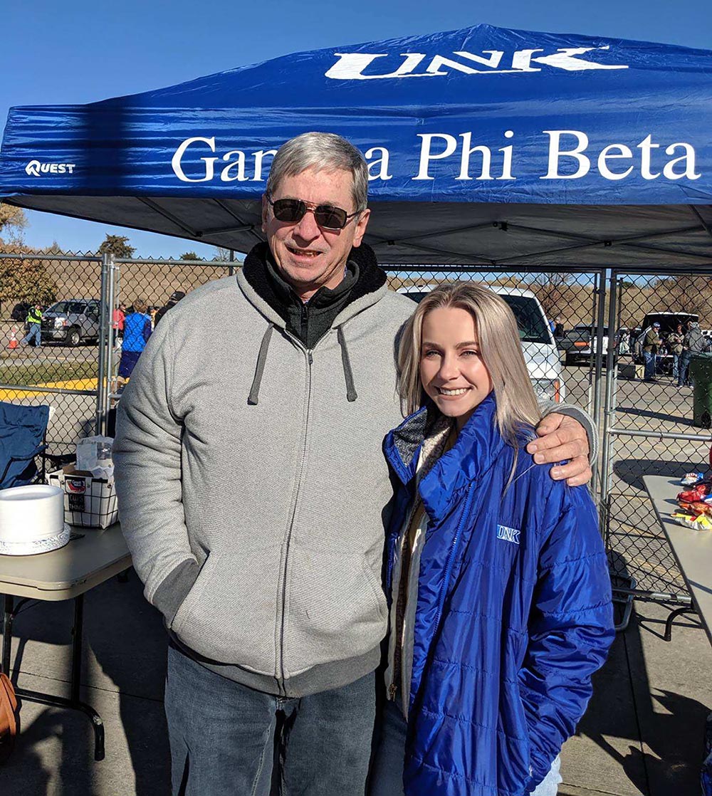 Grace Magill is pictured with her father Jack during a Gamma Phi Beta “Dad’s Day” tailgate at UNK’s Cope Stadium.