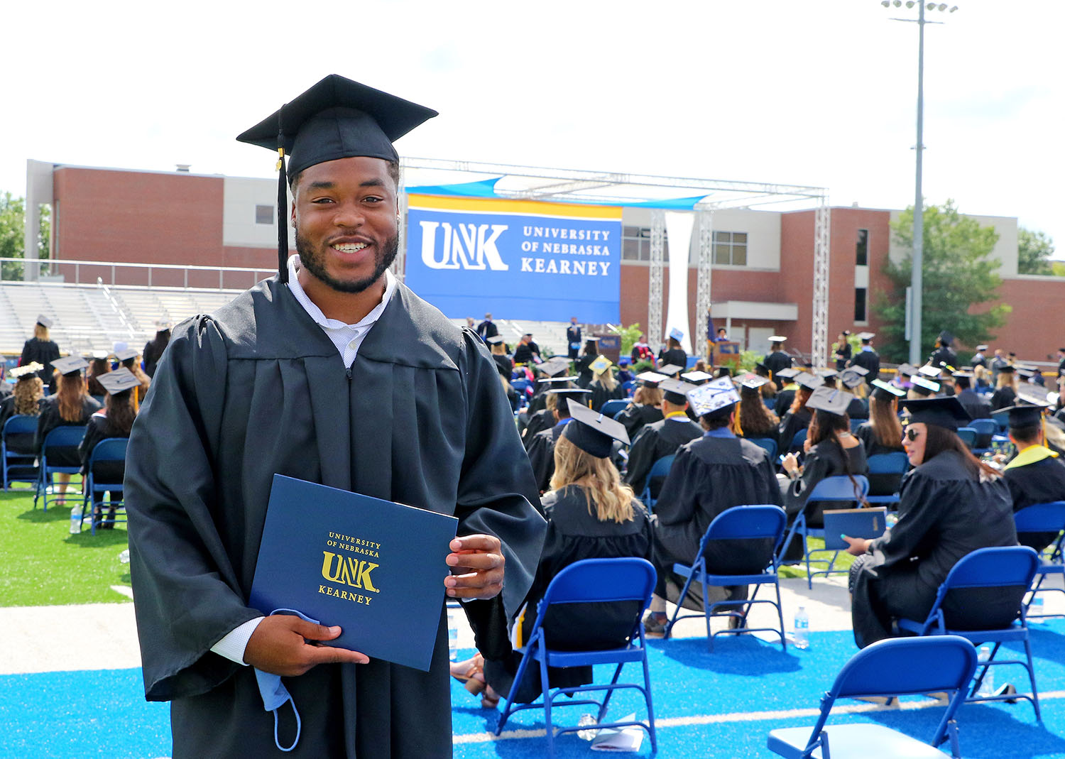 Rakid Hill’s family traveled from St. Louis, Missouri, to watch him receive his degree during Friday’s commencement ceremony at UNK. “My mom and dad wanted to see me walk,” Hill said. “I’m their first kid to graduate from a university, so that was big for them.” (Photos by Todd Gottula, UNK Communications)
