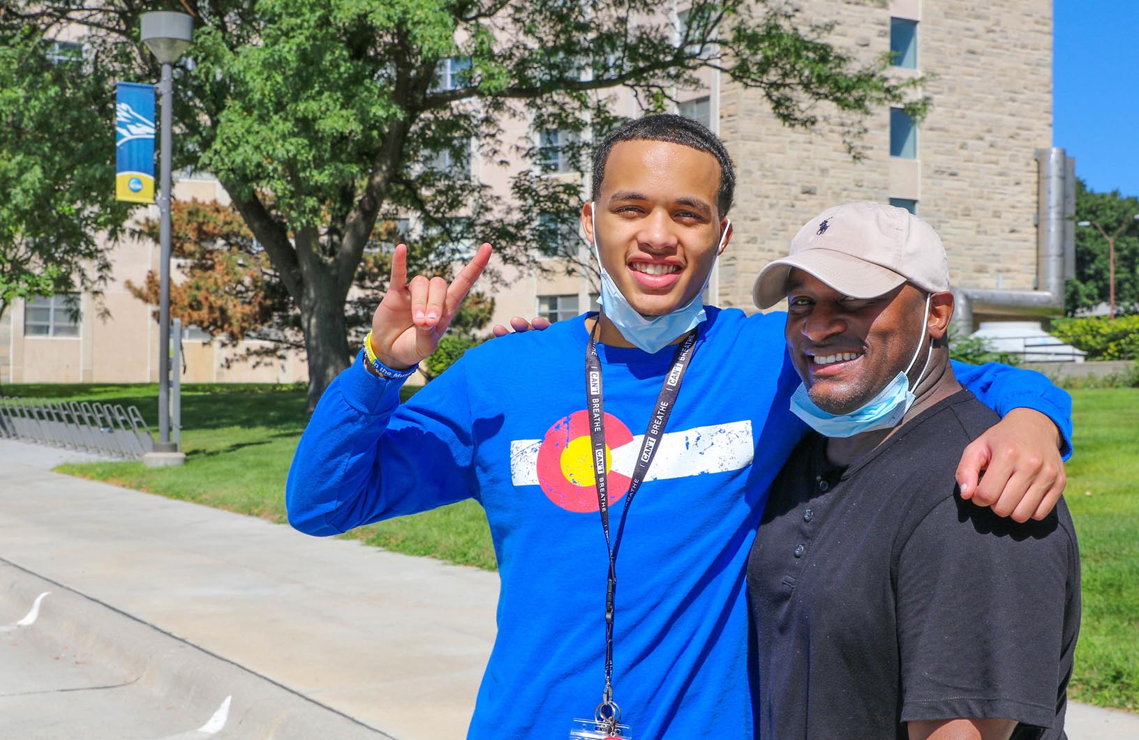 Freshman Matthew Robinson of Colorado Springs, Colorado, left, poses for a photo with his father Michael on the UNK campus. Robinson, who will study business administration, is attending UNK on a football scholarship.
