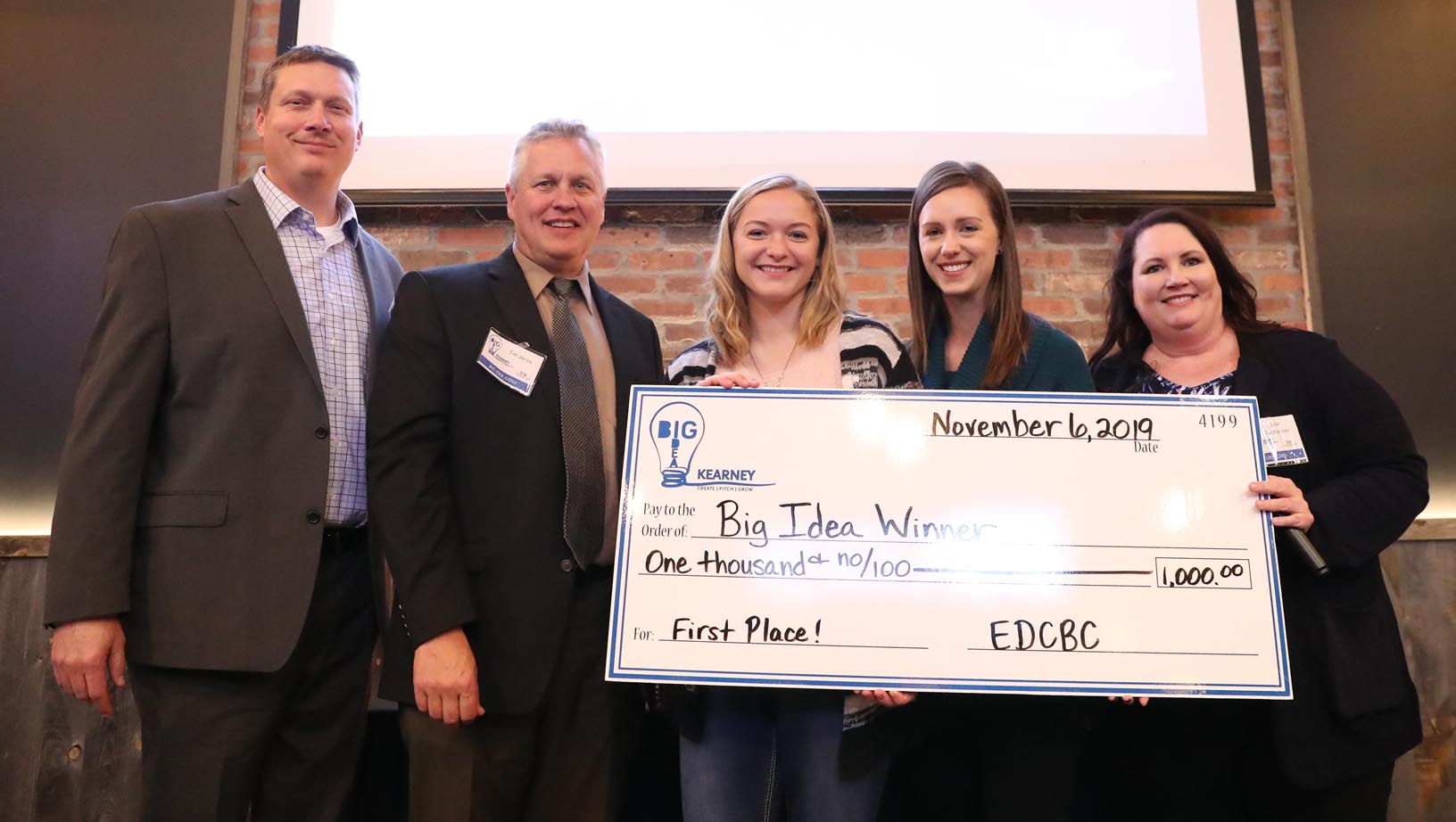 UNK student Nicole Mittman, center, pitched her glow-in-the-dark paintings to win the college division during last year’s Big Idea Kearney competition. This year’s business contest, Big Idea UNK, will be conducted completely online and it’s open only to current UNK students.